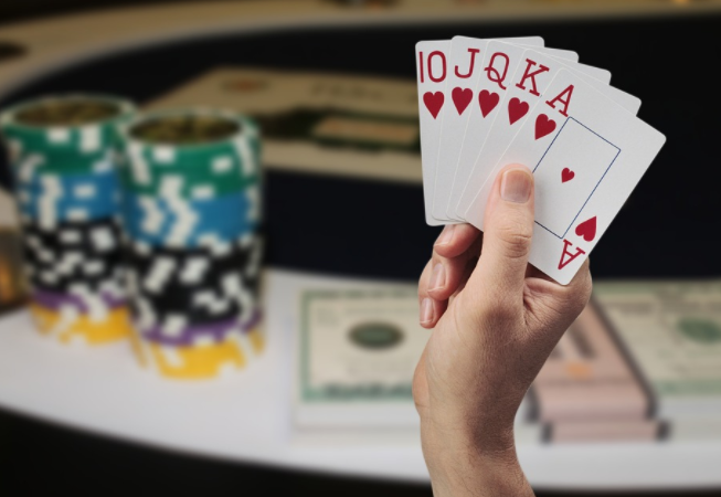 holding poker cards
